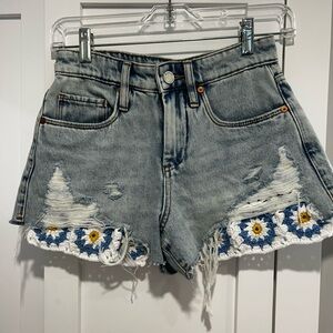Blank NYC Gray Jean Shorts with Distressed Detailing and Floral Embellishments